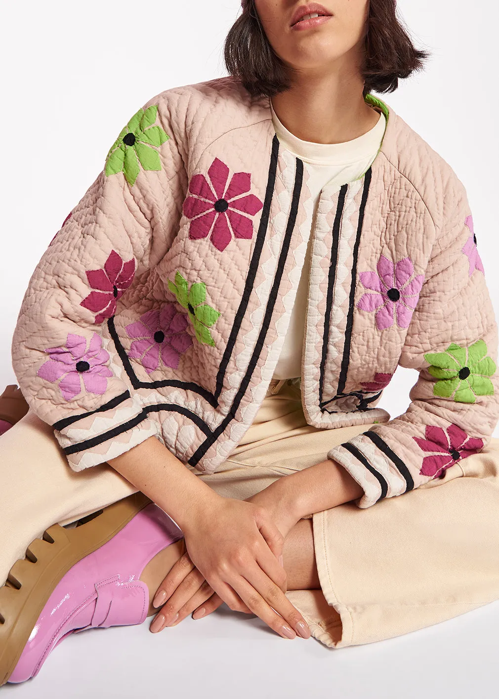 Off-white quilted jacket with flower patches