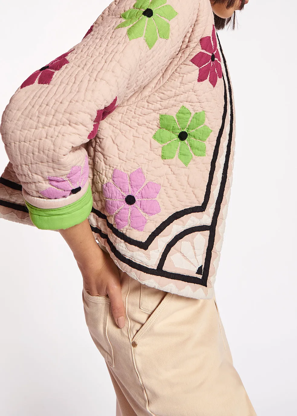 Off-white quilted jacket with flower patches